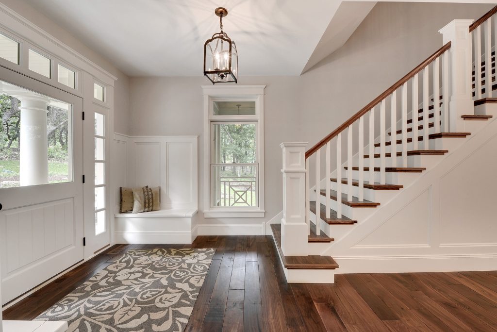 Light-Colored Entrance Way with Dark Wood Floor