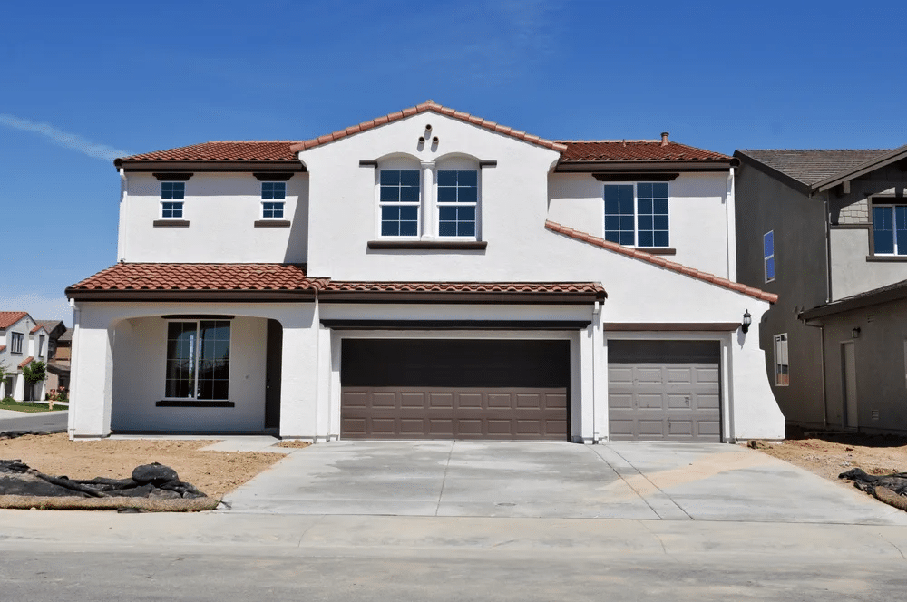 Big Two Story White Stucco Home with Two Garages.jpg