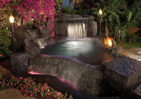 Hot Tub Decorated with Large Boulders and Tiki Torch