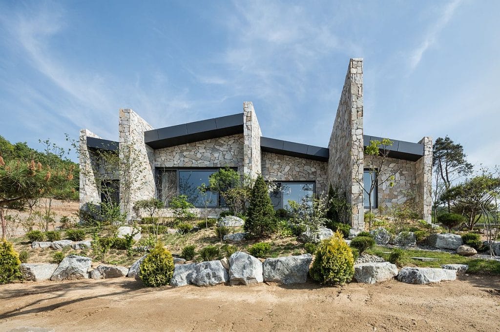 Rough Stone House Blends into the Landscape