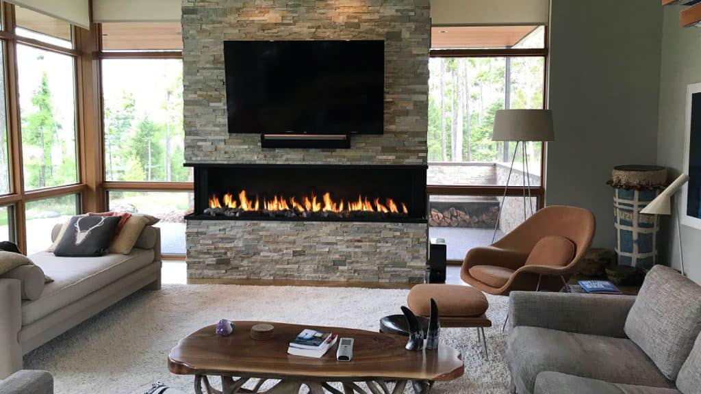 Three-Sided Fireplace Wall with Dual TVs