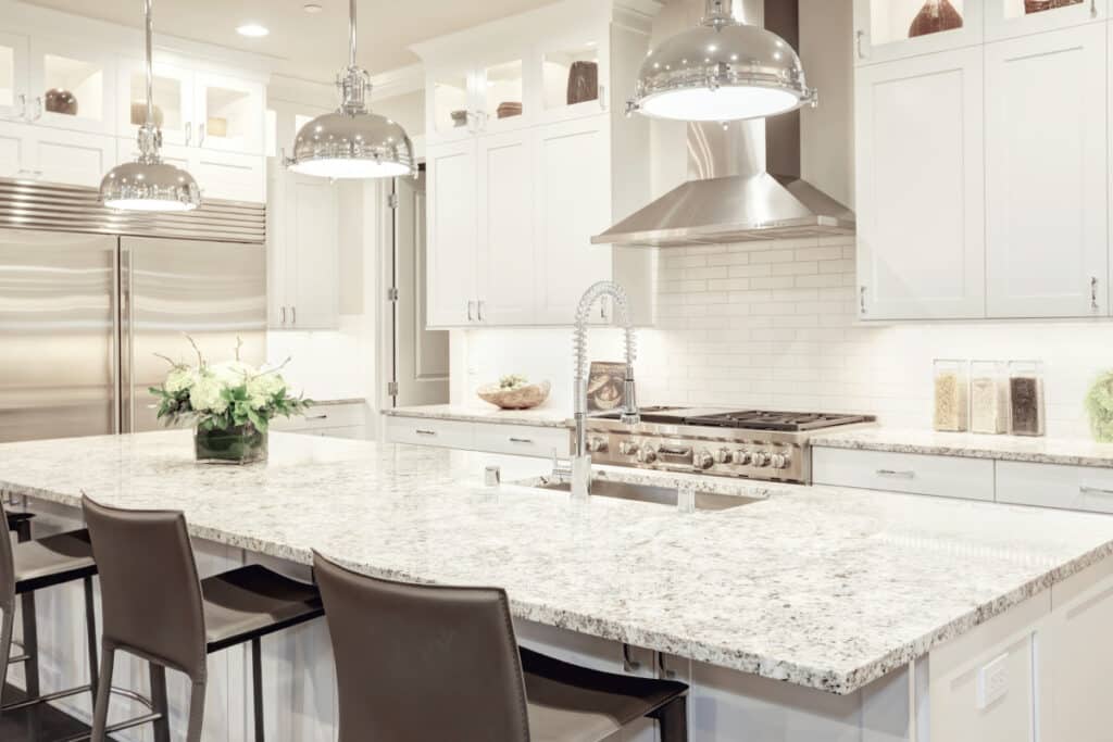 White Pendant Light Over a Brown Marbled Countertop