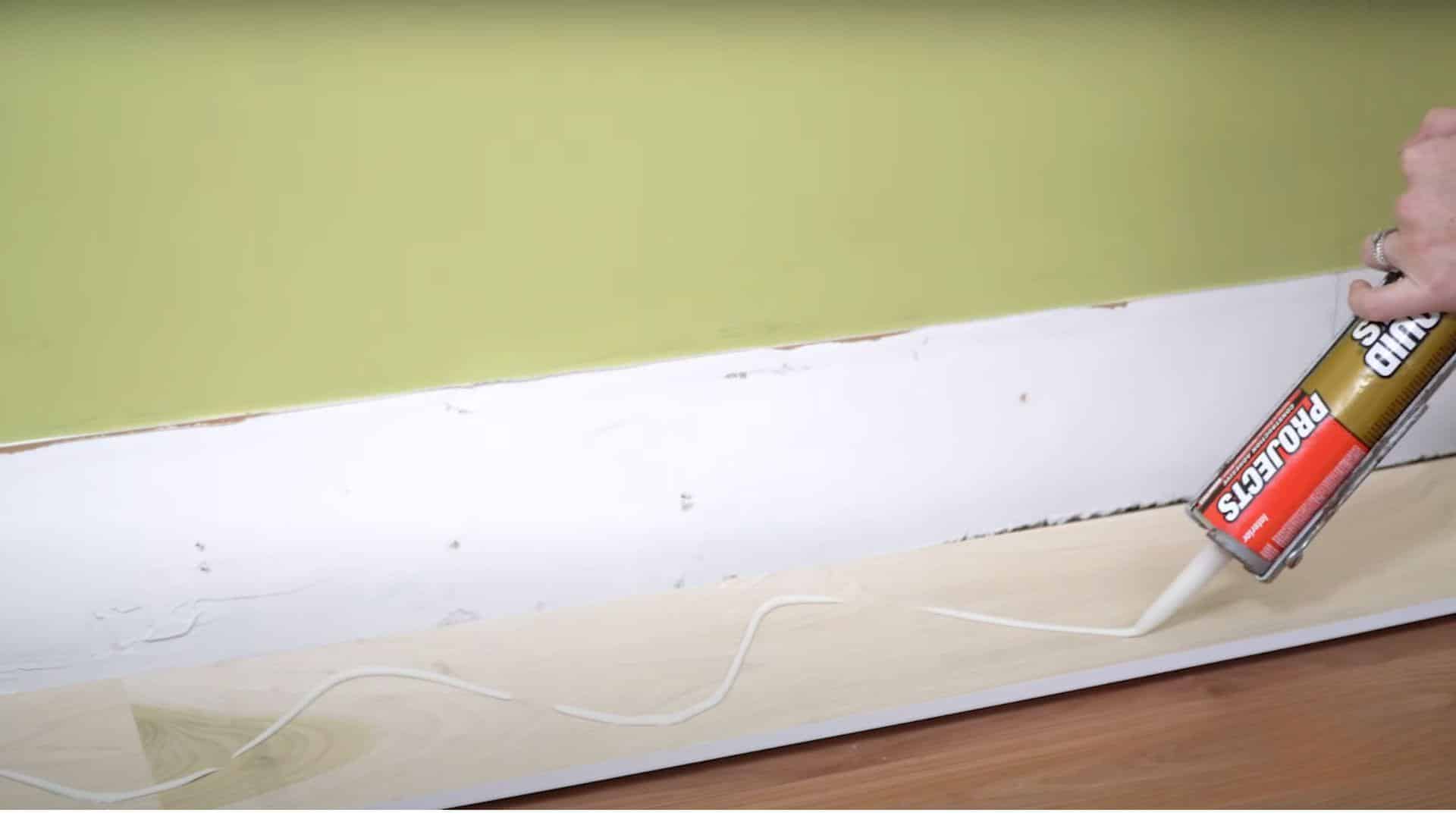 Step_5_Install_the_First_Board_with_Adhesive_and_Nails