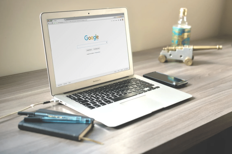 A computer on a table AI-generated content may be incorrect.