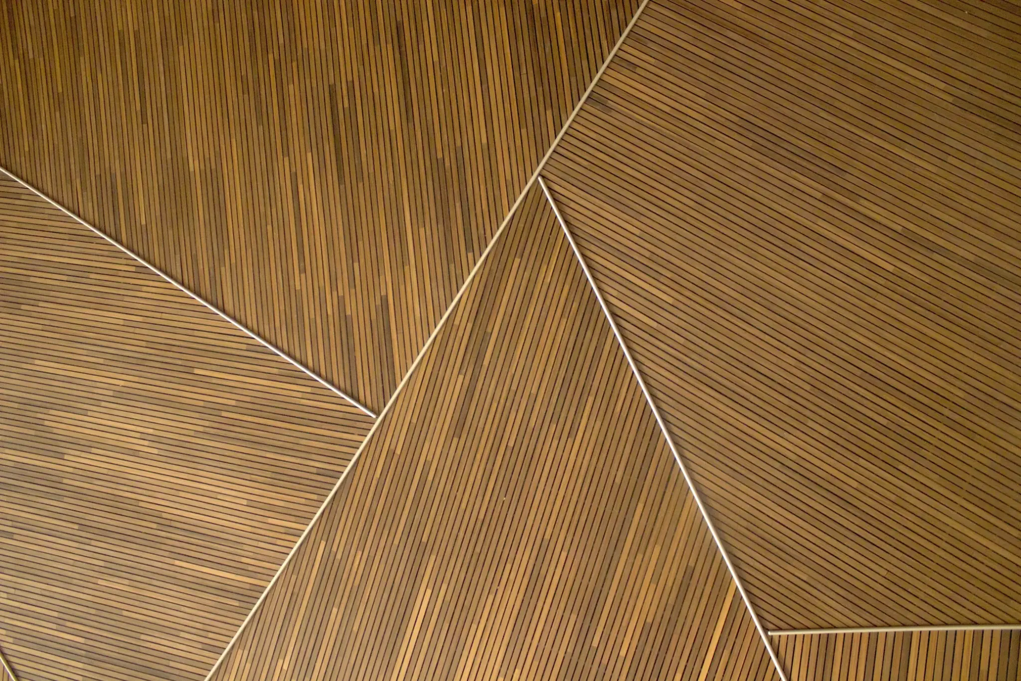 Geometric wooden wall panels with diagonal lines in a modern pattern
