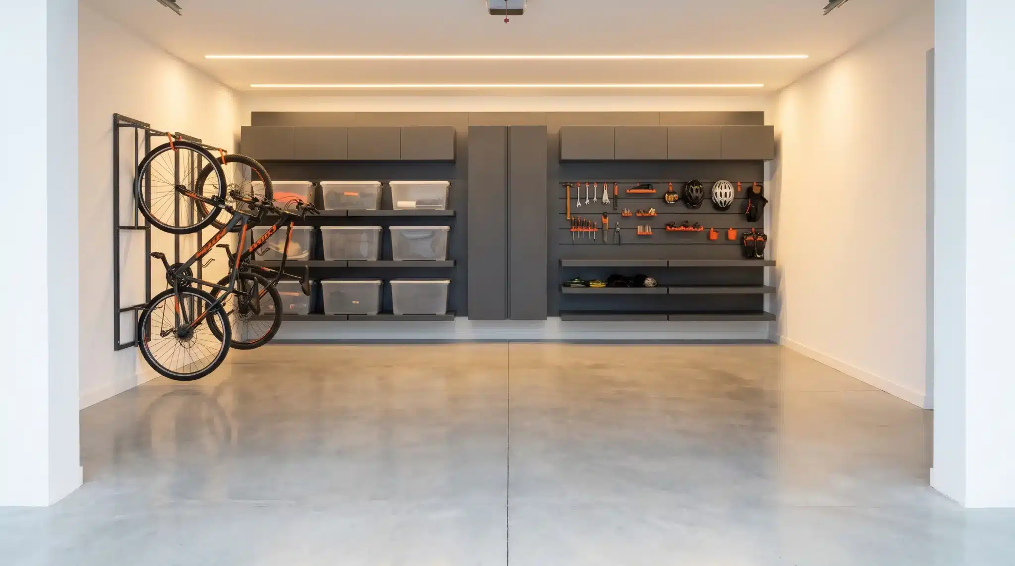 Organized garage with bicycles on wall rack, shelves with storage bins, and tools neatly displayed