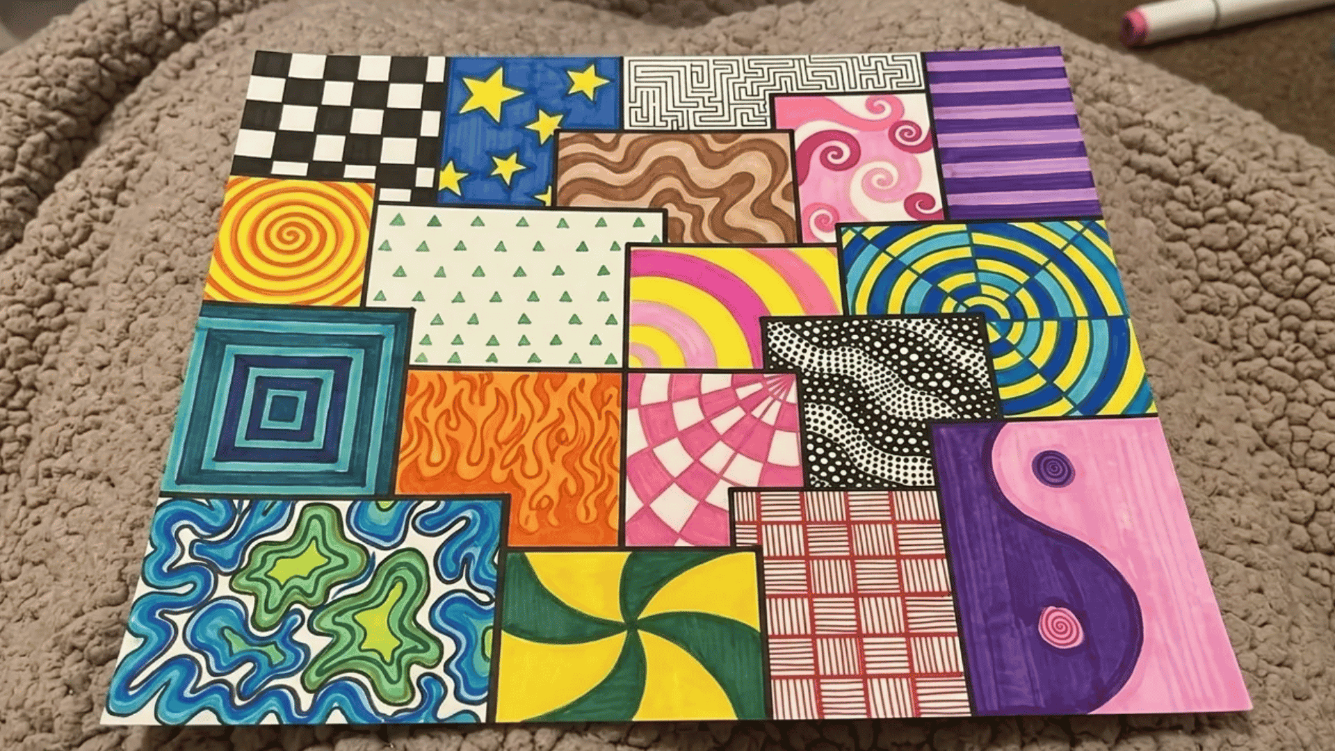 Colorful doodle art made with different geometric patterns, swirls, spirals, and abstract designs in separate squares.