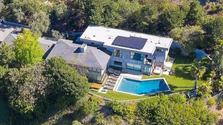 Elon Musk’s expanded Bel-Air estate featuring multiple connected luxury mansions, modern glass architecture, landscaped grounds, outdoor pool, and upscale Los Angeles hillside surroundings