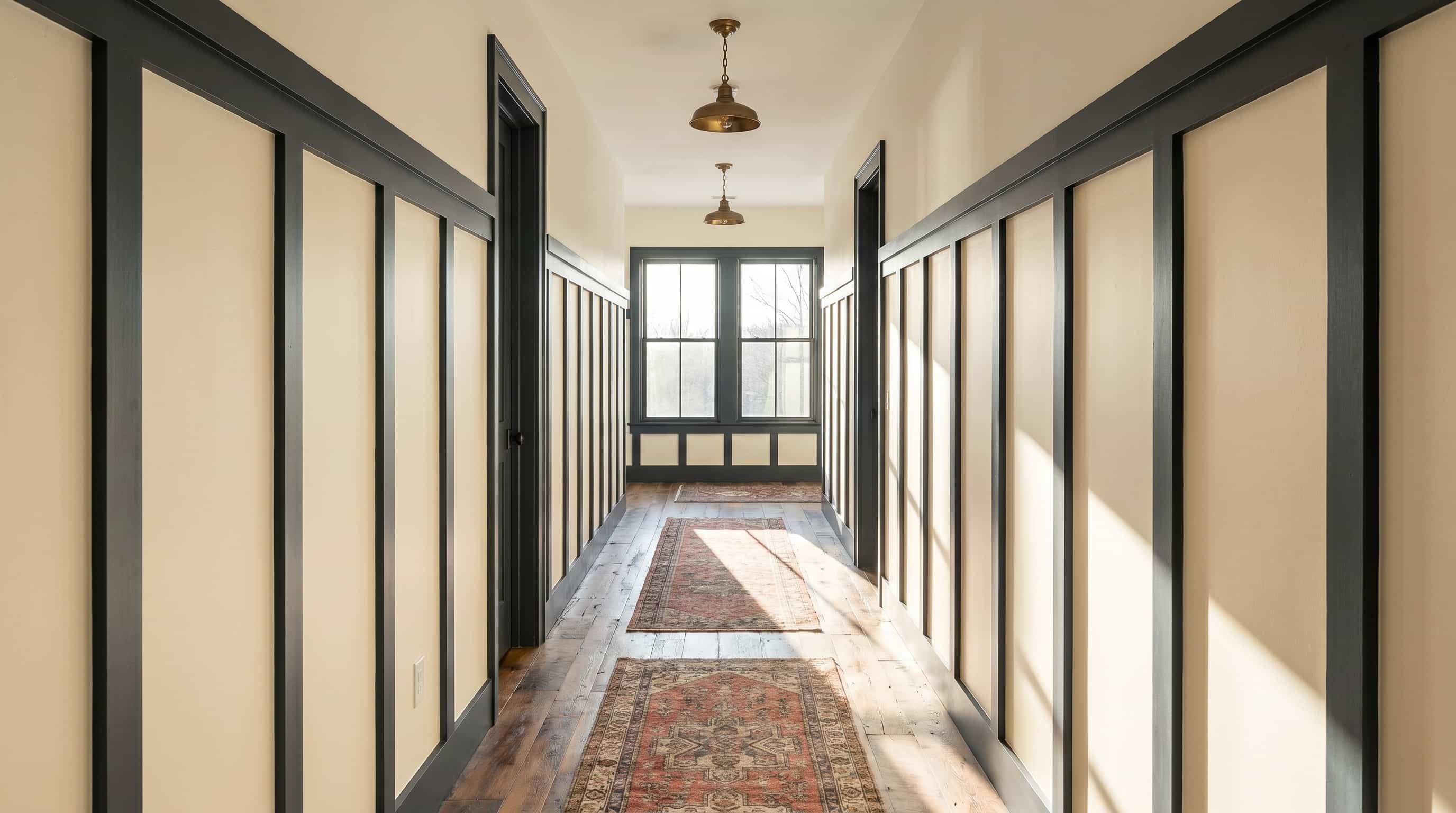 Classic hallway decor ideas enhanced by board and batten wall paneling, traditional runners, and timeless architectural details.