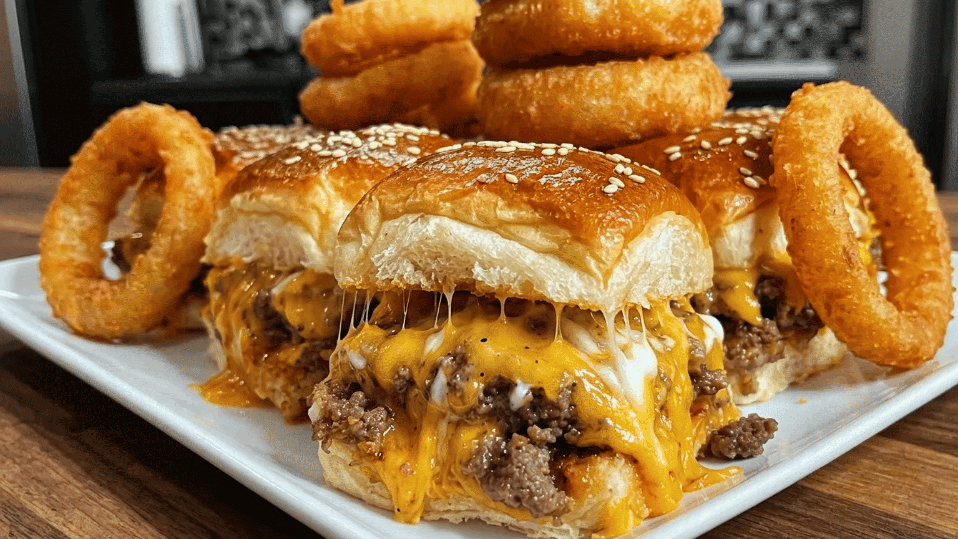 Cheesy burger sliders with crispy onion rings for a fun diner-style Friday night dinner.