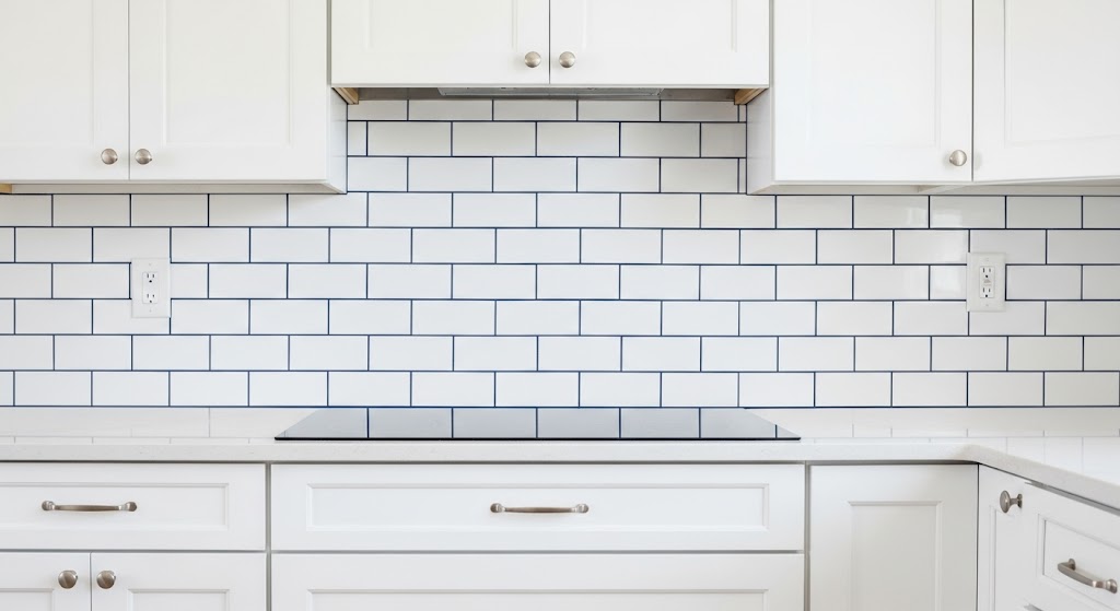 Classic white ceramic subway tiles framed by striking, dark charcoal contrast grout lines.