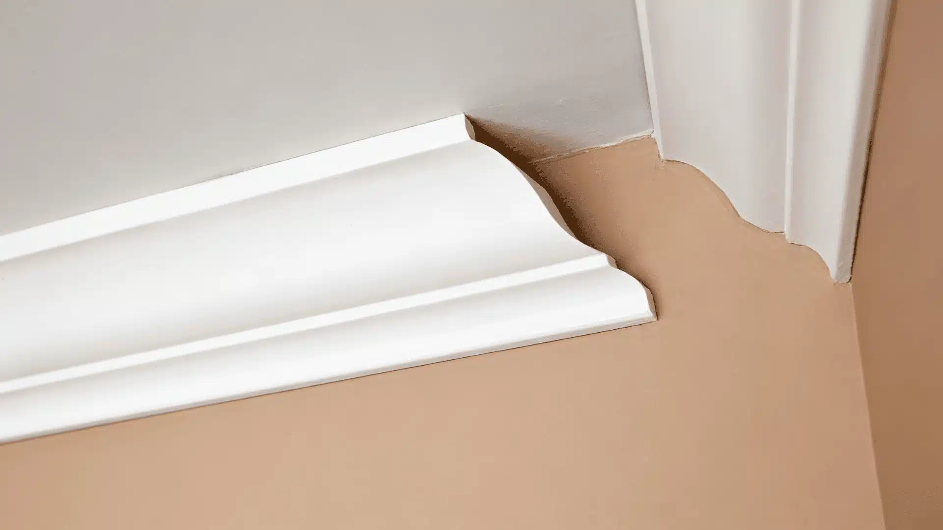 Coped molding joint fitted tightly at an inside wall corner