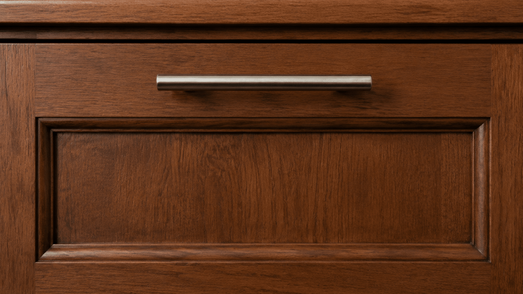 Drawer front with pull positioned 2 inches from top edge, aligned with adjacent door pulls.