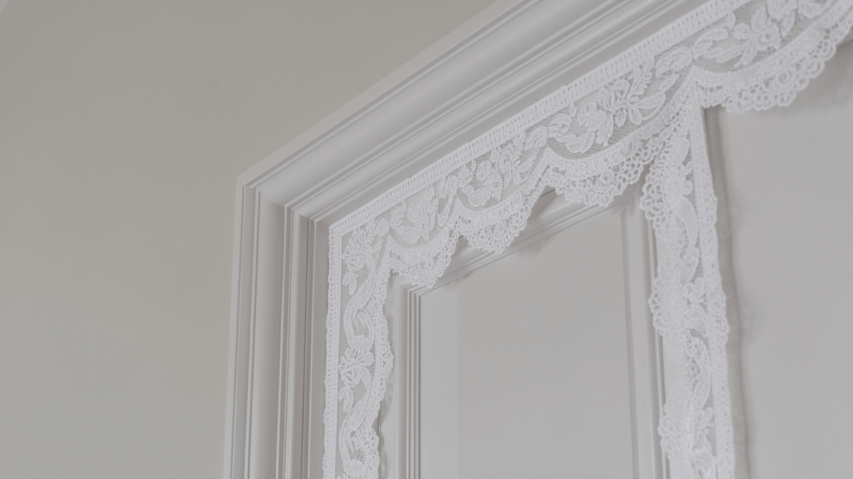 Trim and moldings painted Chantilly Lace contrasting with matte walls showing clean details