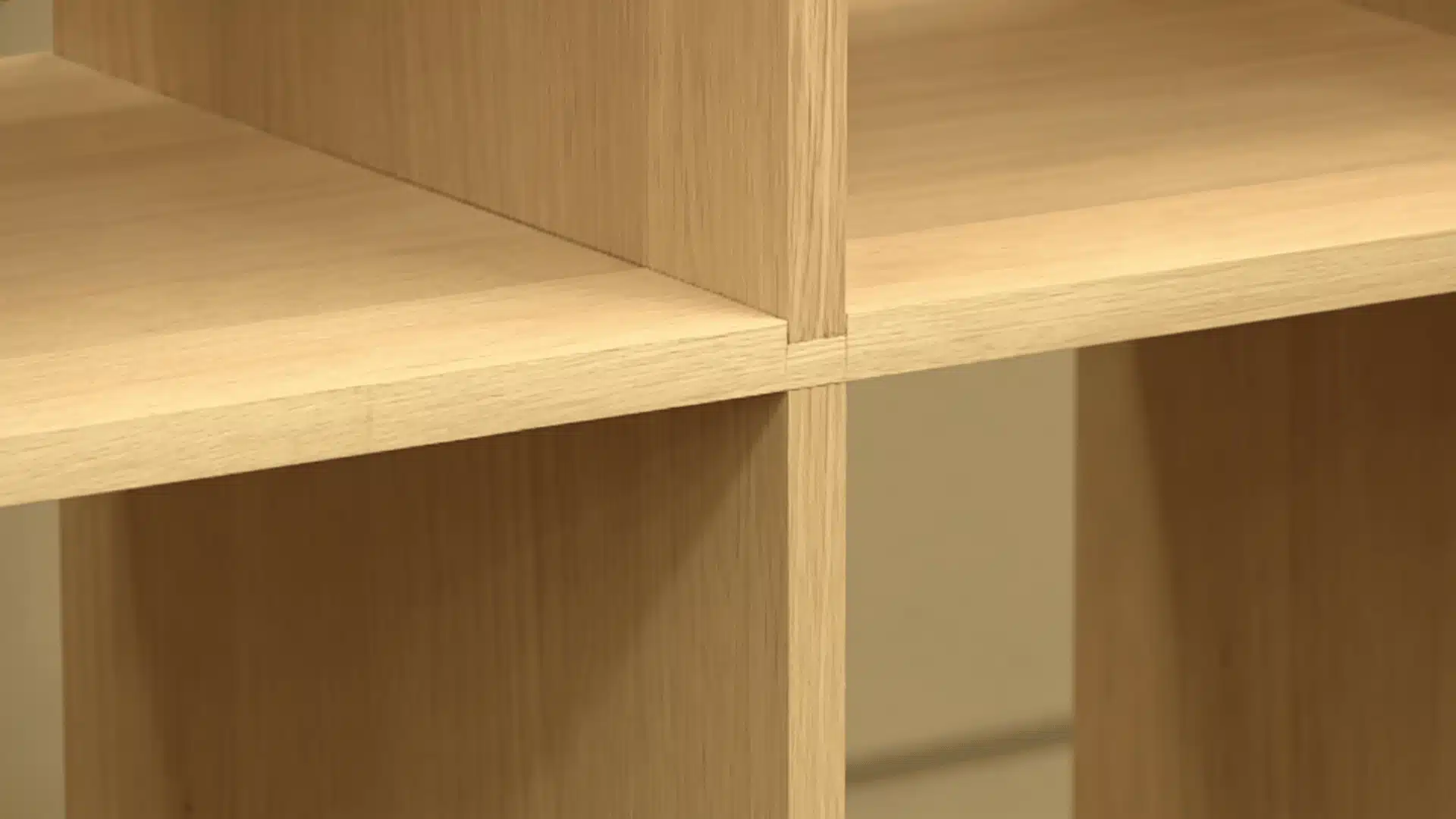 Shelf board fitted into a dado groove in a wooden panel