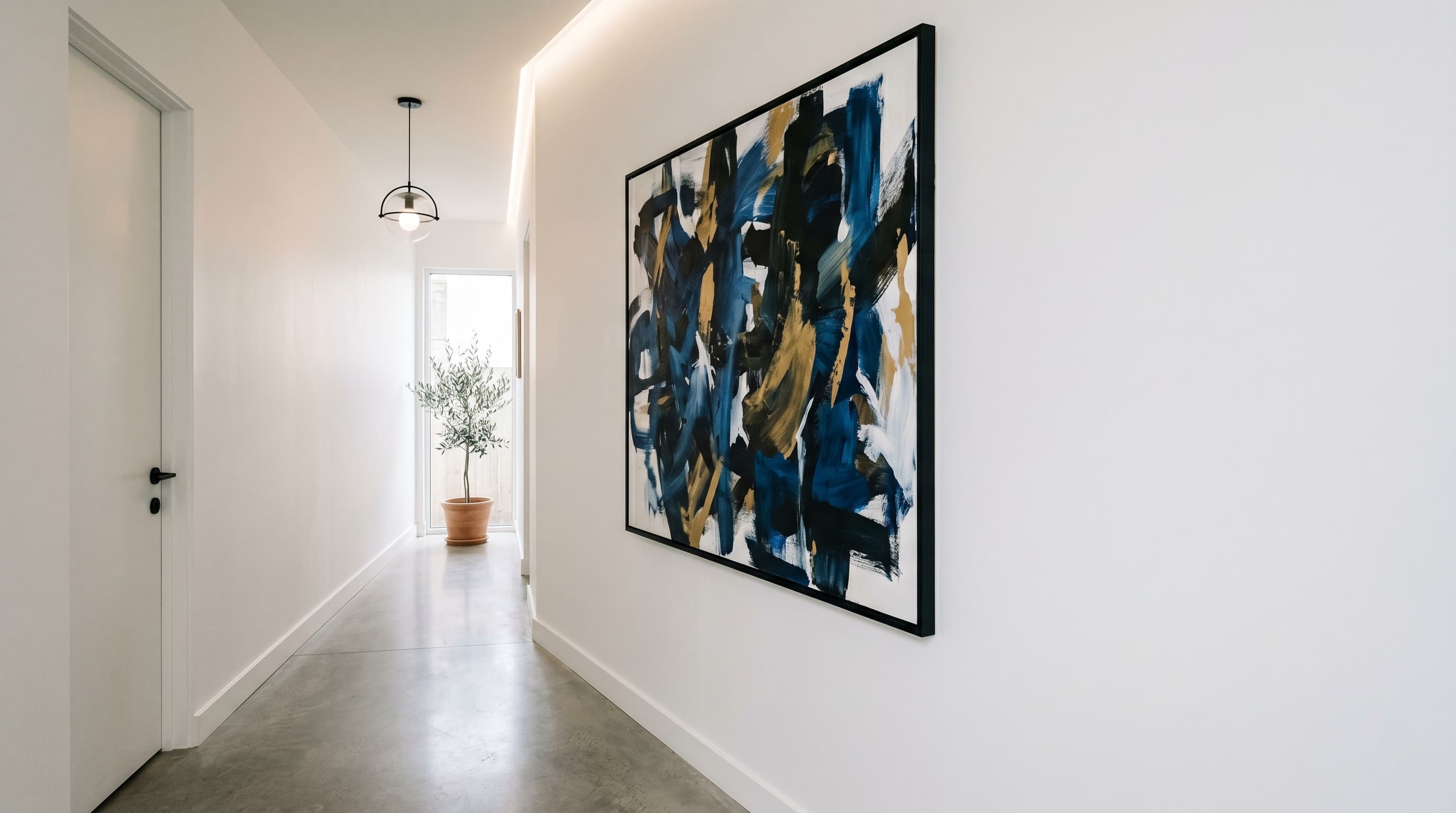 Hallway decor ideas highlighting a large abstract statement artwork that creates a clean, modern focal point.