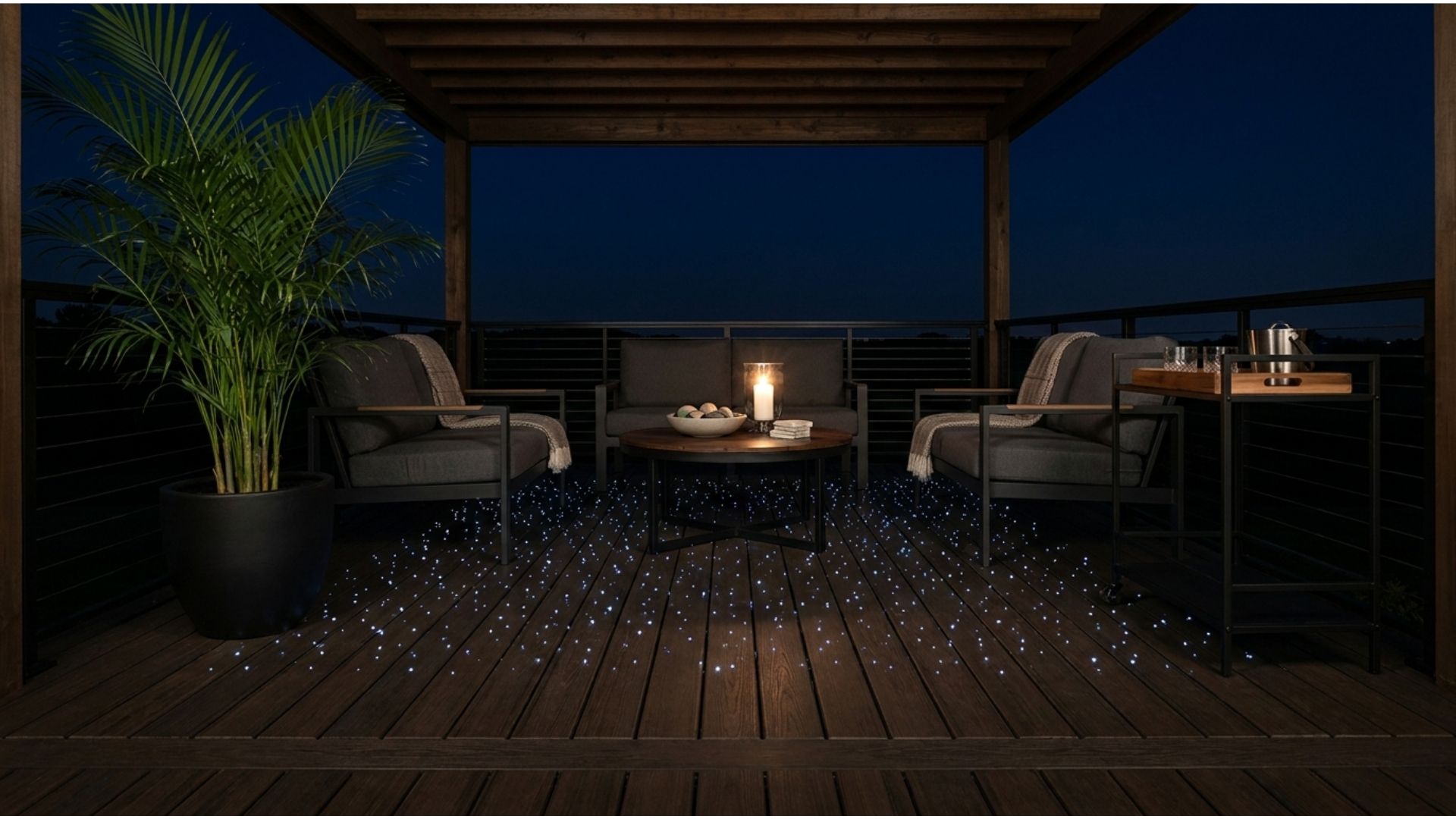Dark composite deck floor at night with scattered fiber optic light dots glowing like stars across the boards