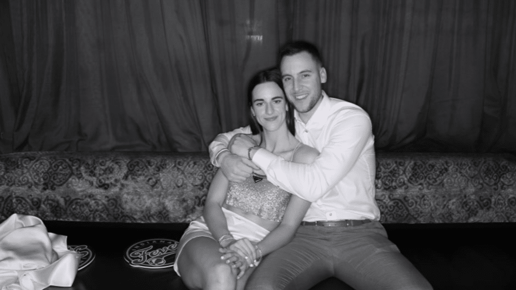 Caitlin Clark with her boyfriend Connor McCaffrey sitting together at an event.