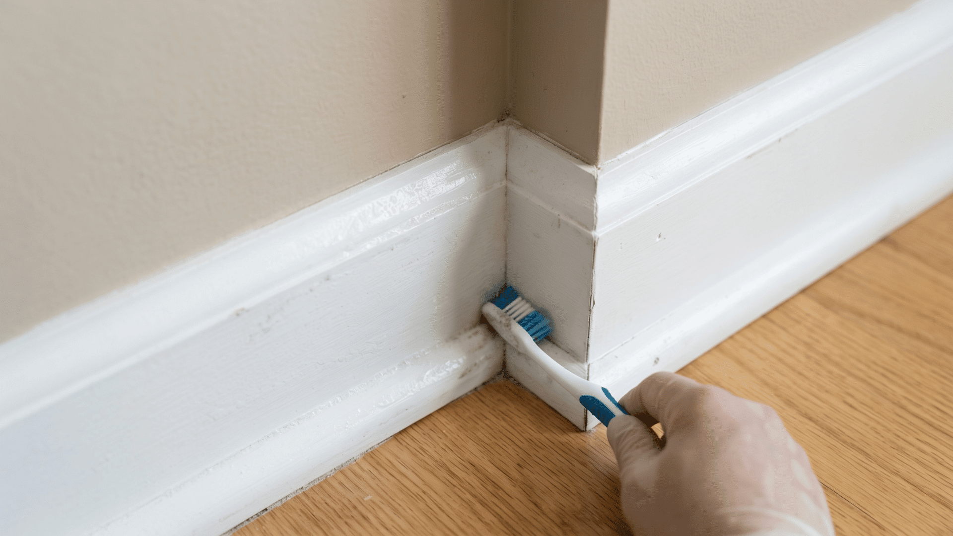 Toothbrush cleaning vinyl baseboard scrubbing corner seam