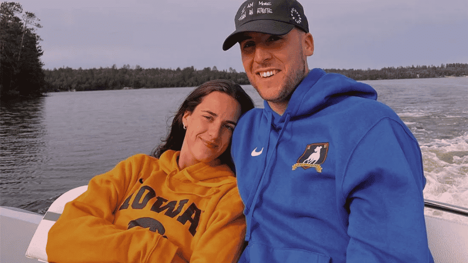 Caitlin Clark boyfriend Connor McCaffery and her smiling while relaxing together on a boat.