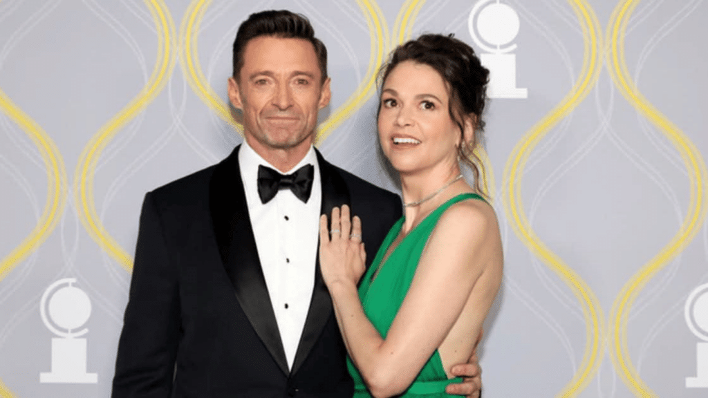 Hugh Jackman and Sutton Foster posing together at a formal awards event