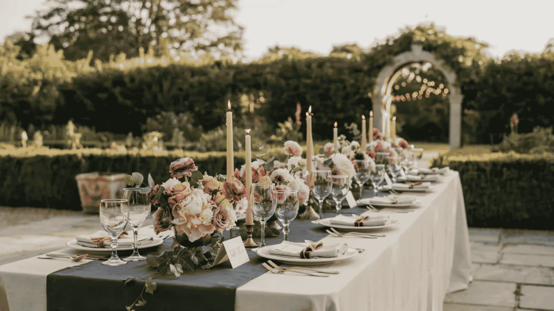 Navy blue wedding decor with blush flowers and gold accents