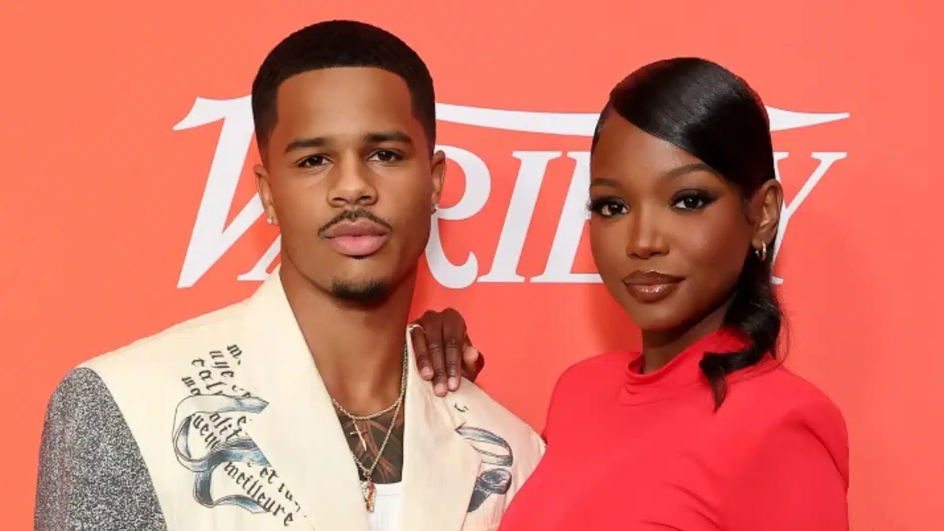 Ace Greene and Chelley Bissainthe posing together at a red-carpet event.