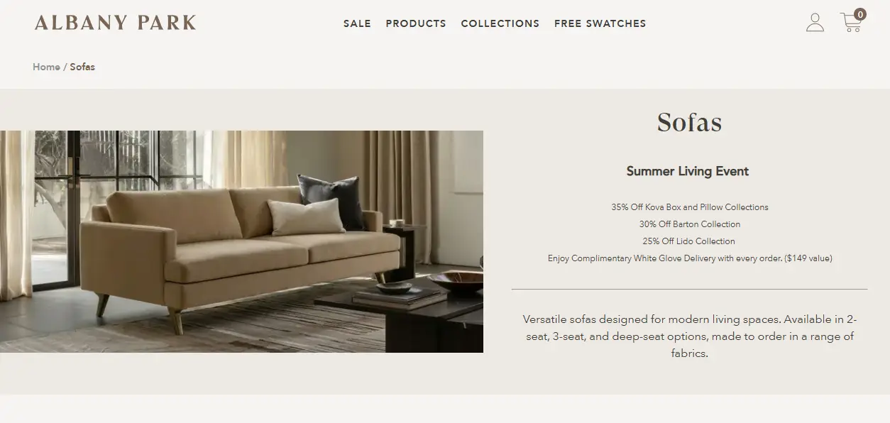 Tan sofa with cushions in modern living room with large windows and neutral curtains