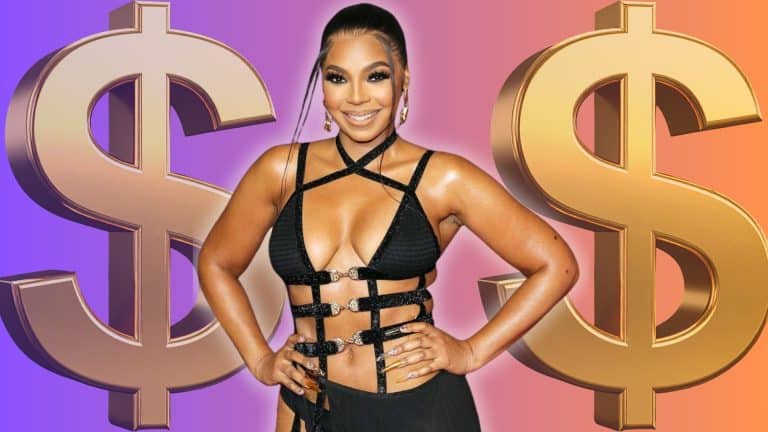 Ashanti in a black cutout outfit posing between two large gold dollar signs on a purple and orange background.