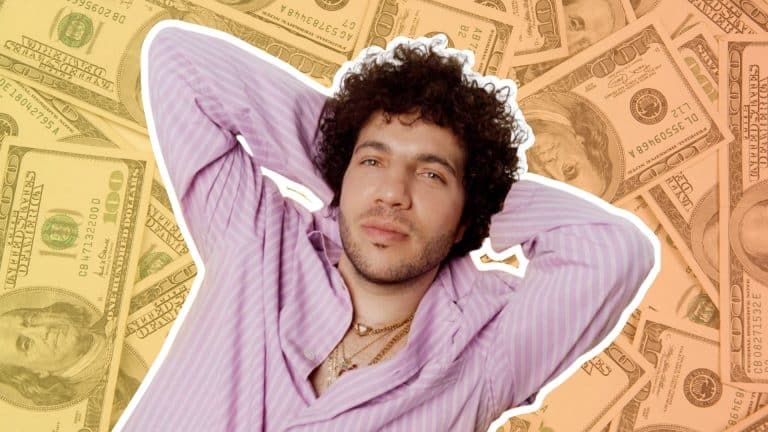 Benny Blanco in a pink striped shirt against a background of U.S. dollar bills.