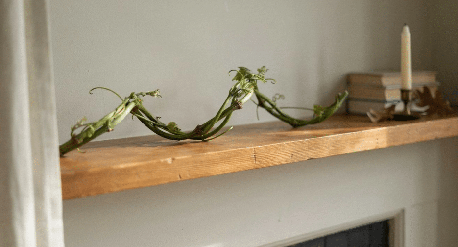 Braided grapevine garland draped along a fireplace mantel