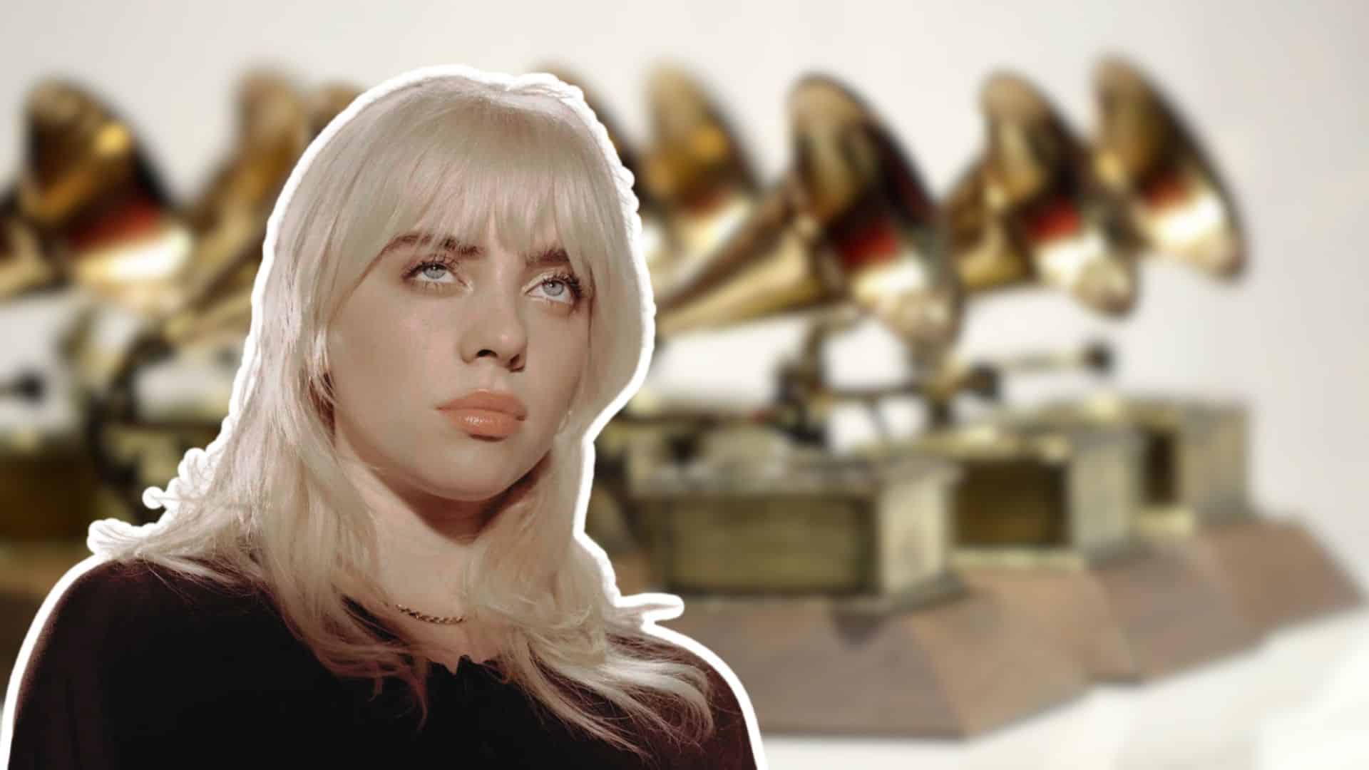 Billie Eilish with blonde hair in front of Grammy Awards trophies