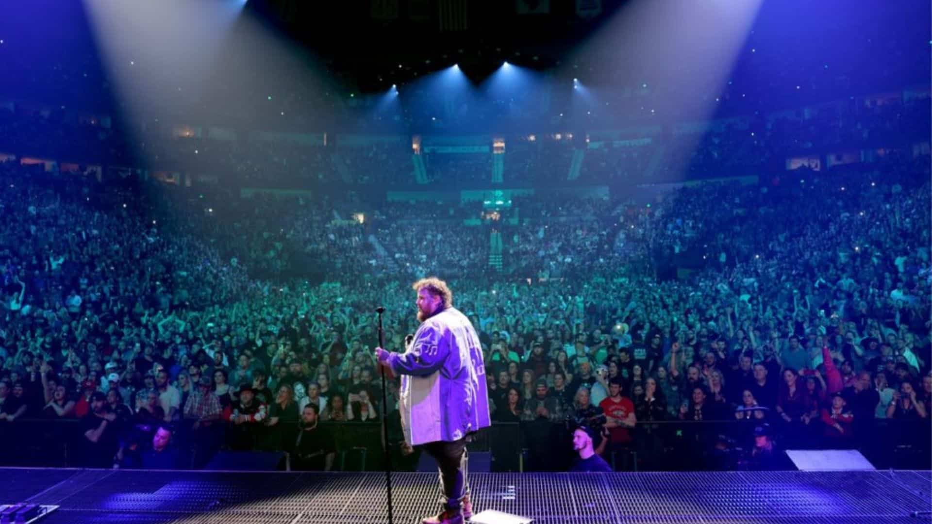 Jelly Roll at a concert, singing in front of his audience