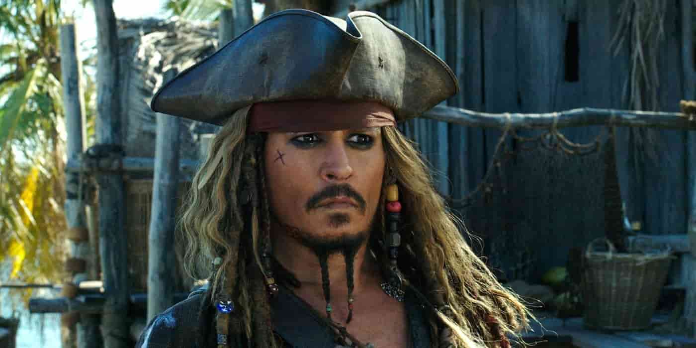 Johnny Depp as Captain Jack Sparrow in Pirates of the Caribbean, wearing a tricorn hat and beaded dreadlocks.