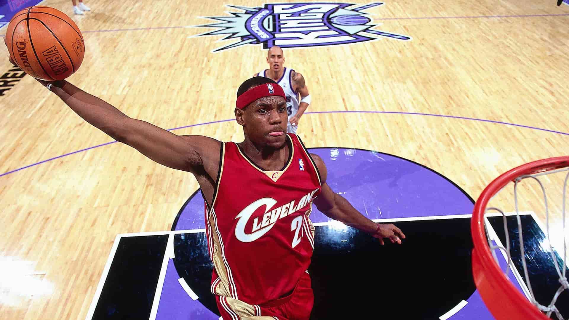 LeBron James dunking during his early Cleveland Cavaliers career against the Sacramento Kings