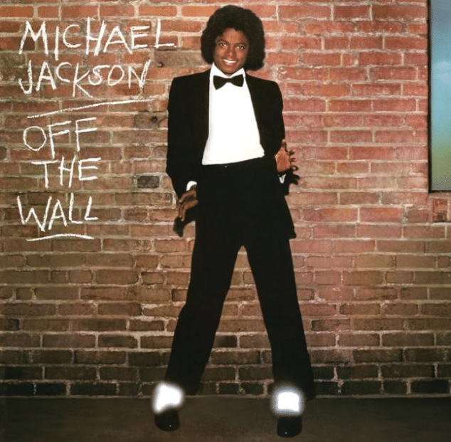 Off the Wall album cover featuring a person in a black tuxedo standing against a brick wall.