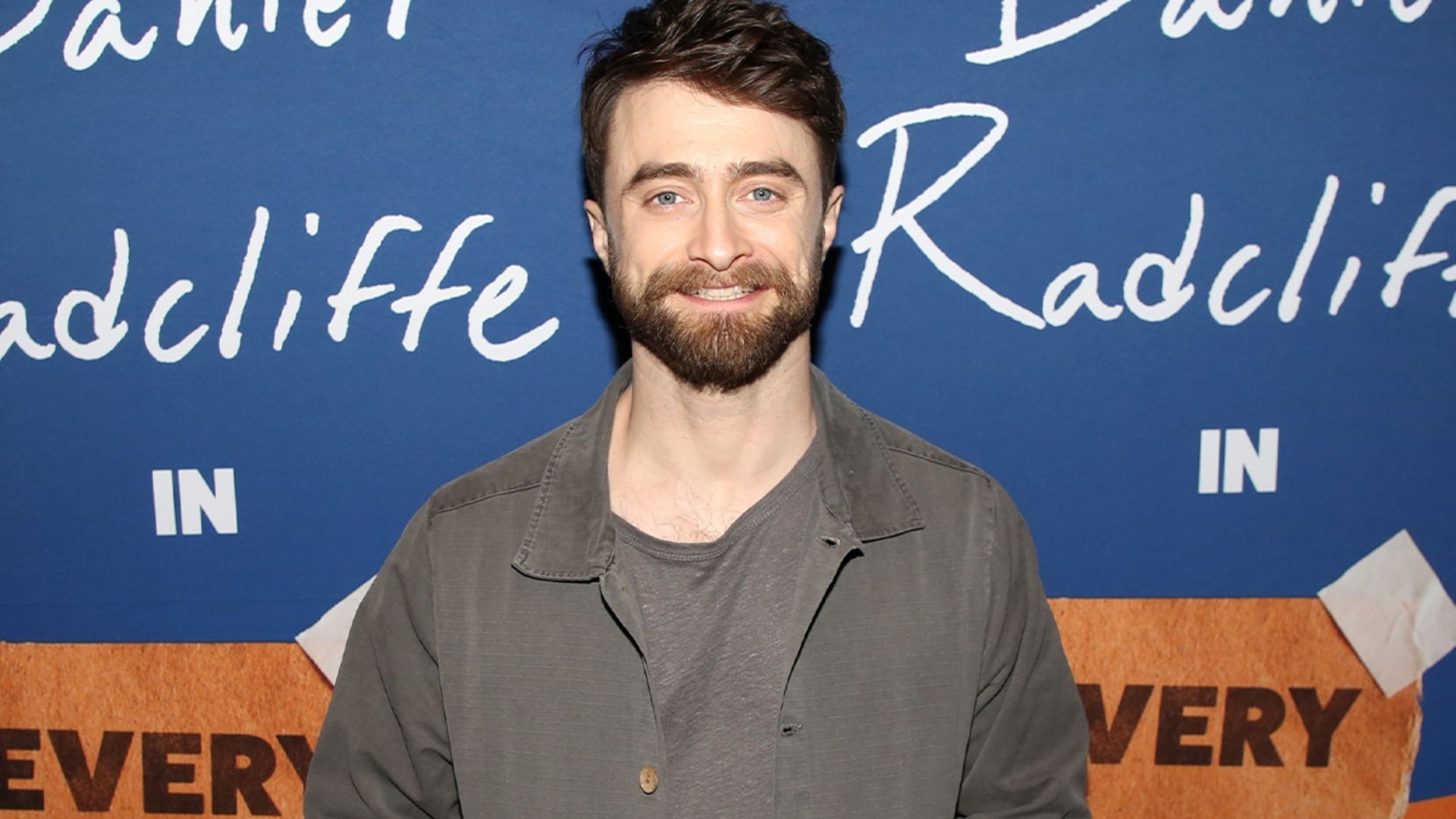 Daniel Radcliffe smiling at the Weird: The Al Yankovic Story premiere.