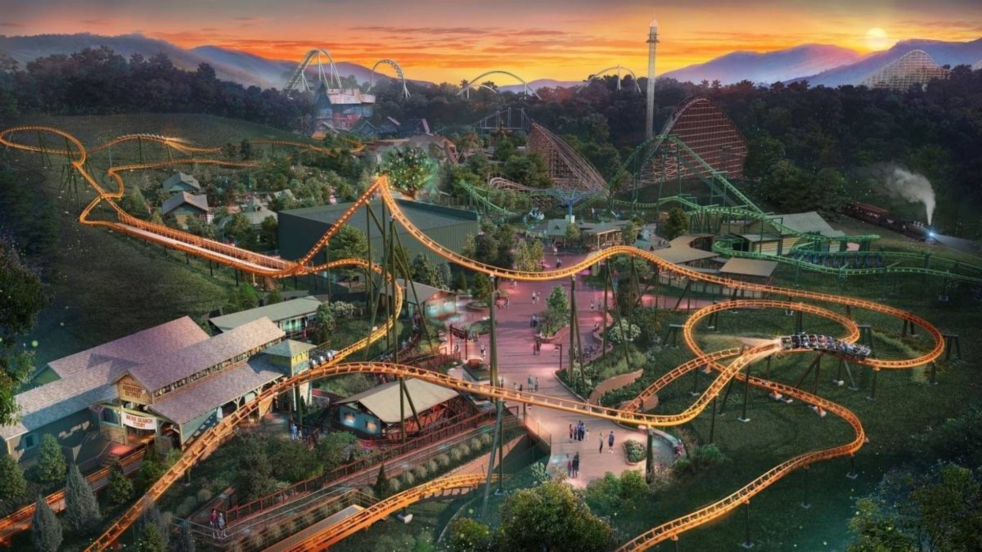 Dollywood theme park with illuminated roller coasters against the Smoky Mountains at sunset.
