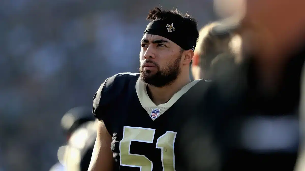 Manti Te’o wearing his New Orleans Saints uniform on the sideline during an NFL game.