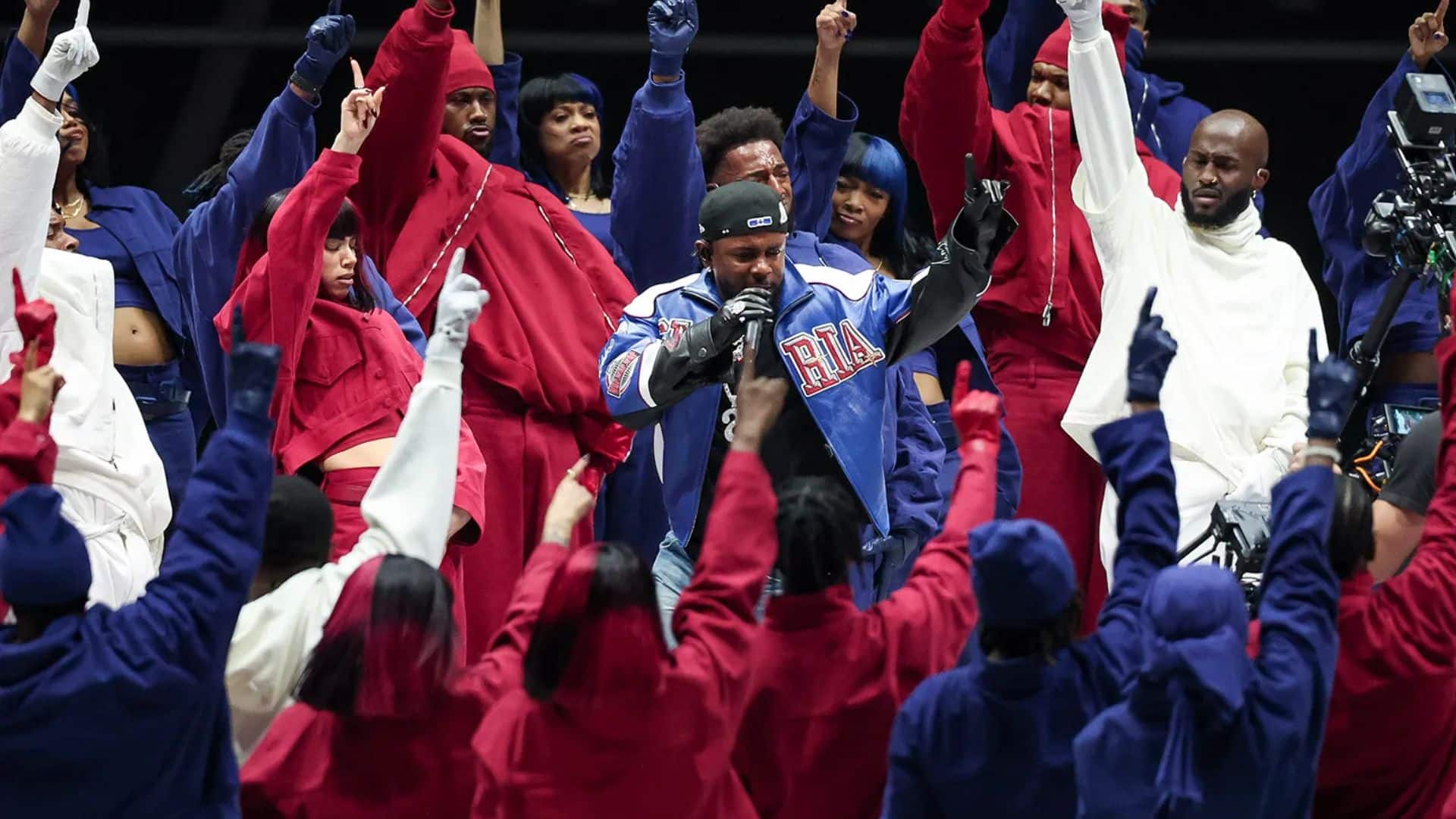 Kendrick Lamar performing on stage during the Super Bowl halftime show.