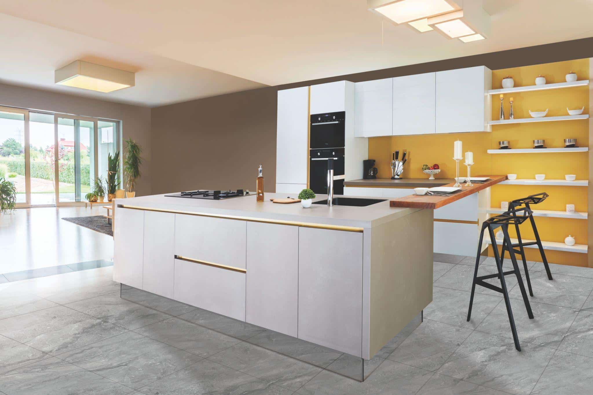 Modern kitchen with large island, minimalistic bar stools, and open shelving on yellow accent wall