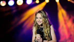 Sabrina Carpenter childhood photos showing her early interest in singing and performing.