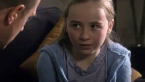 Young Sabrina Carpenter performing on stage during the early years of her music career.