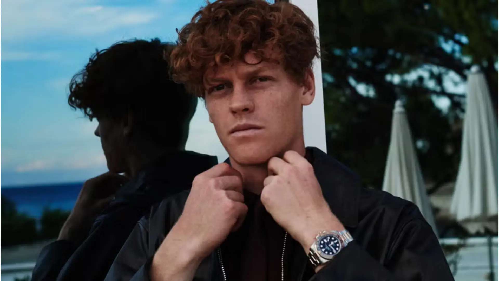 Jannik Sinner in high-fashion black apparel representing major brand endorsements.